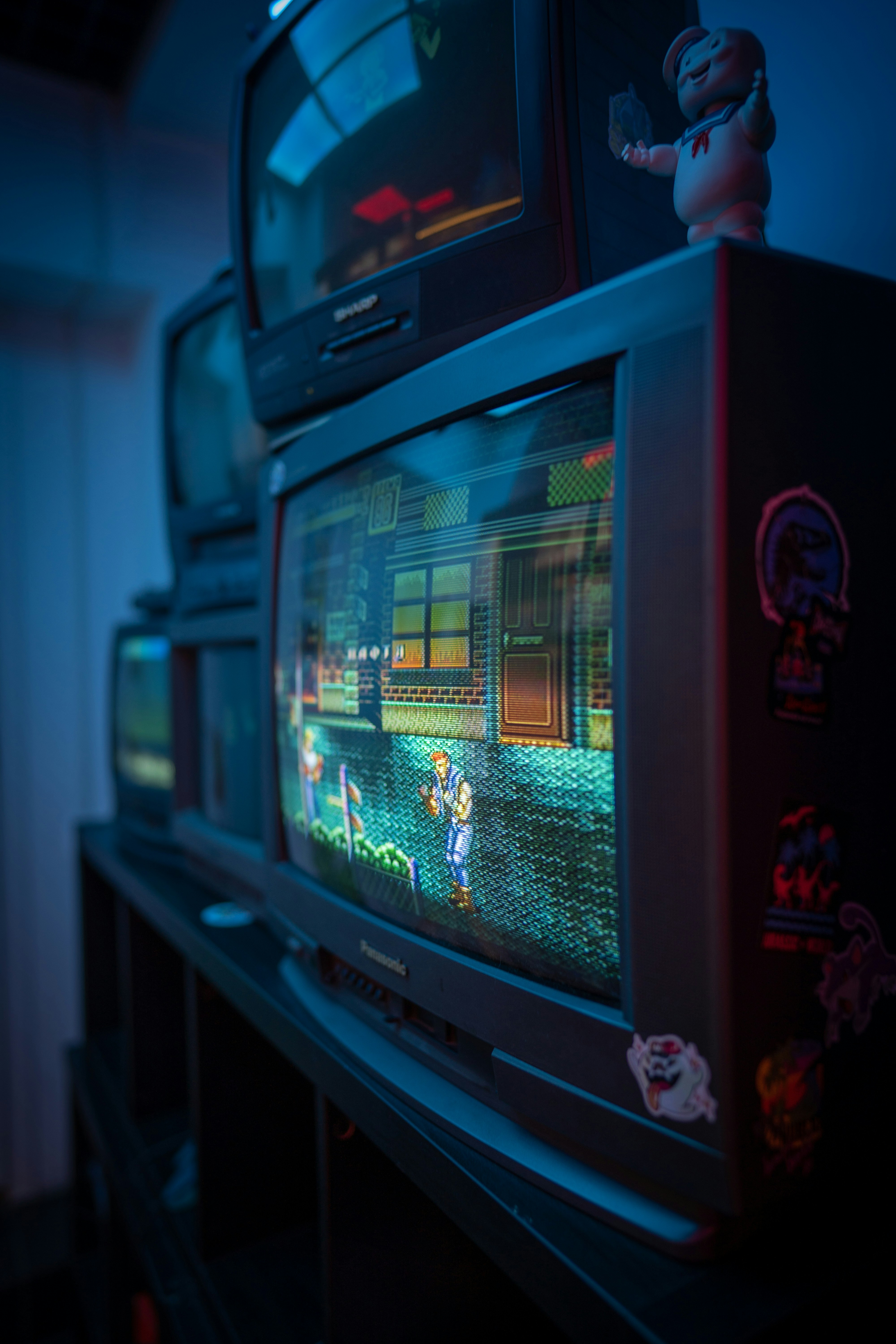 black crt tv turned on in a room